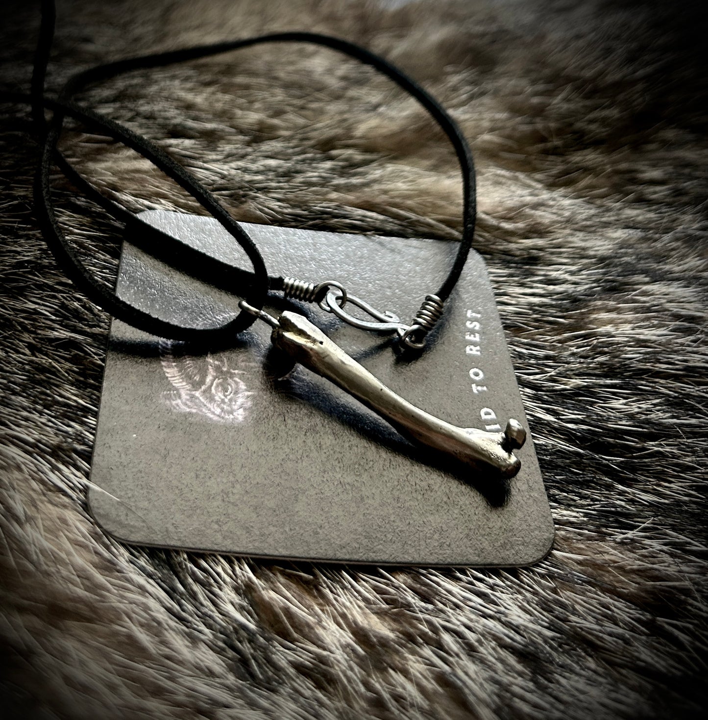 Silver Femur Pendant