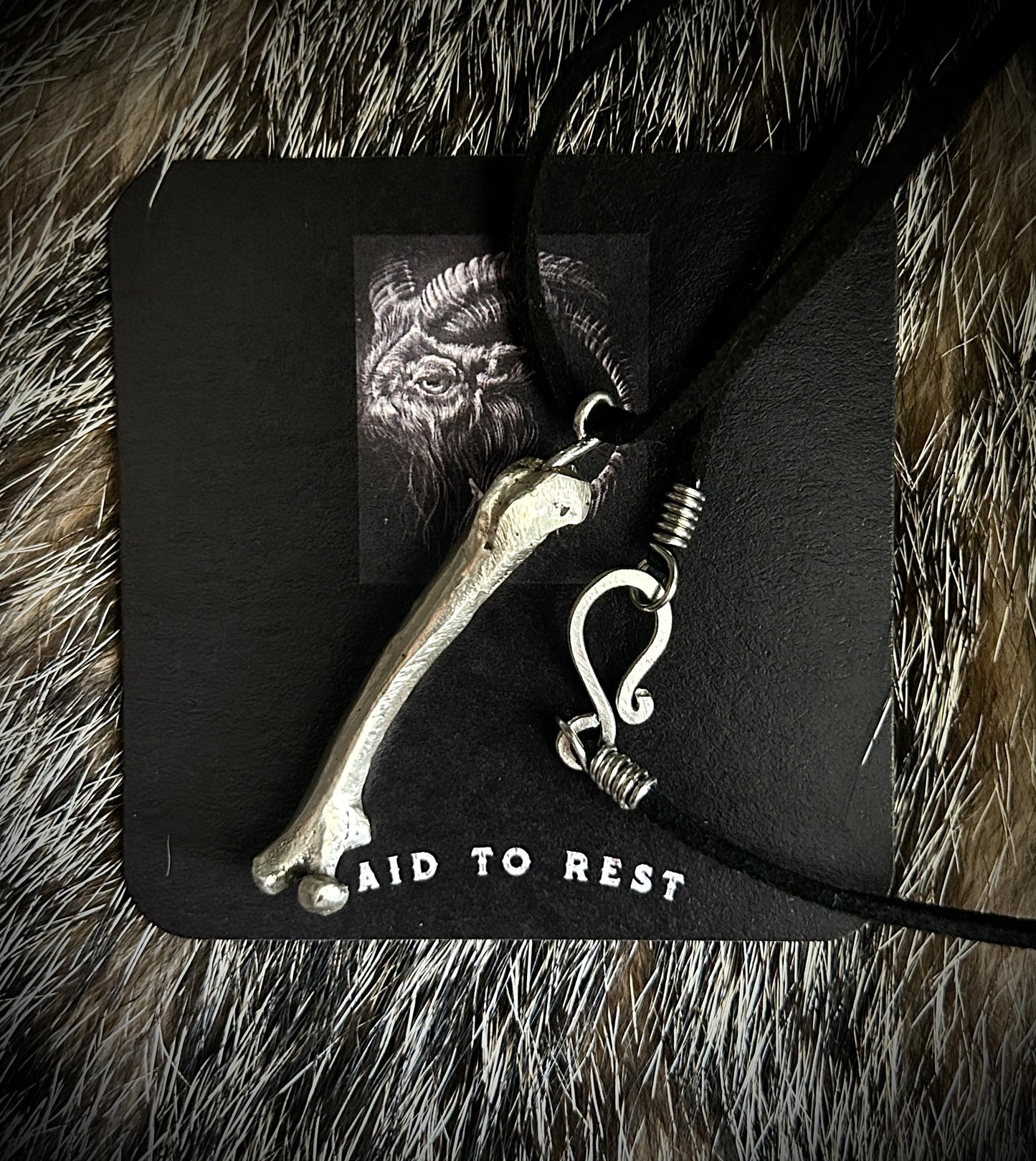 Silver Femur Pendant