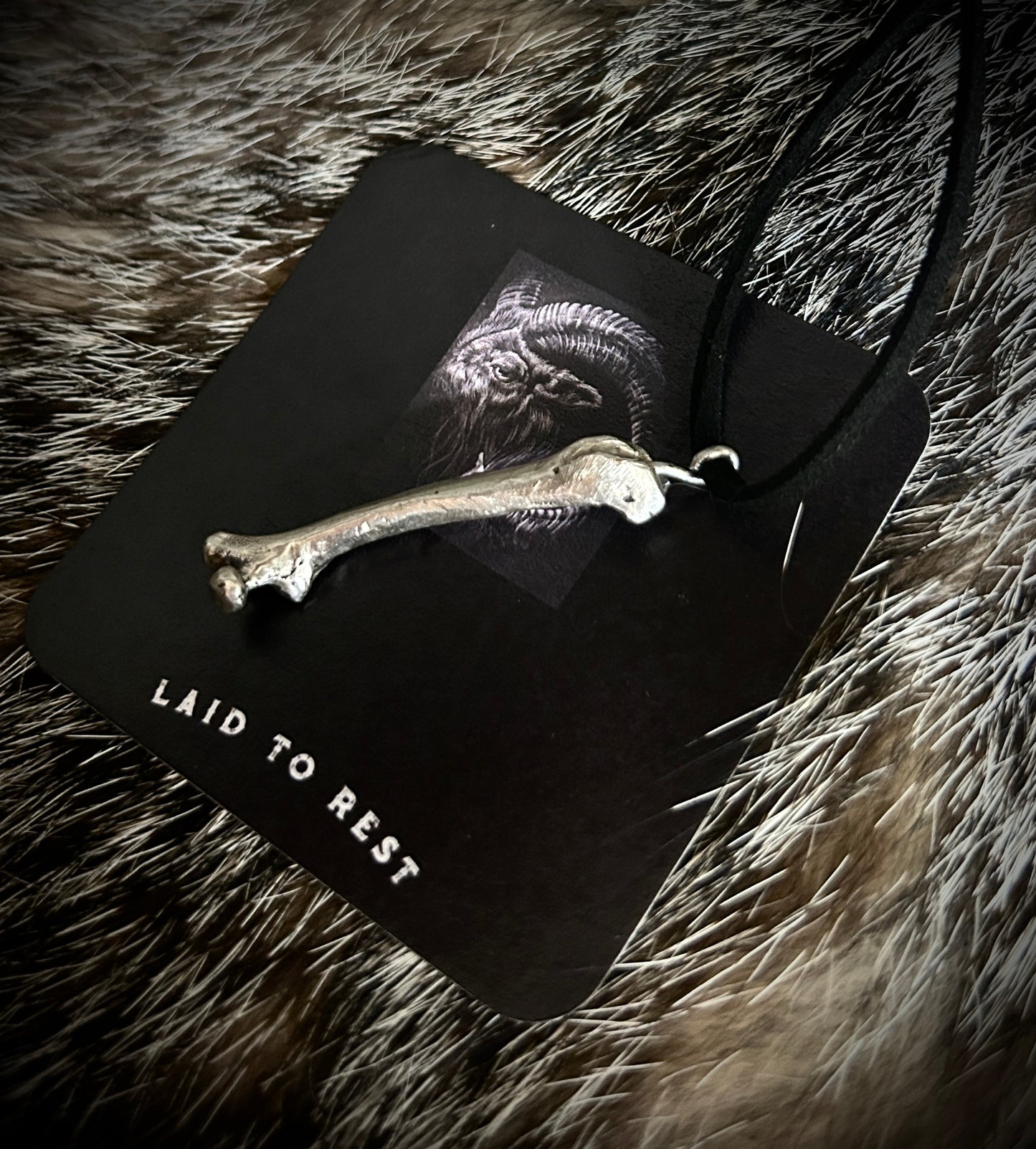 Silver Femur Pendant
