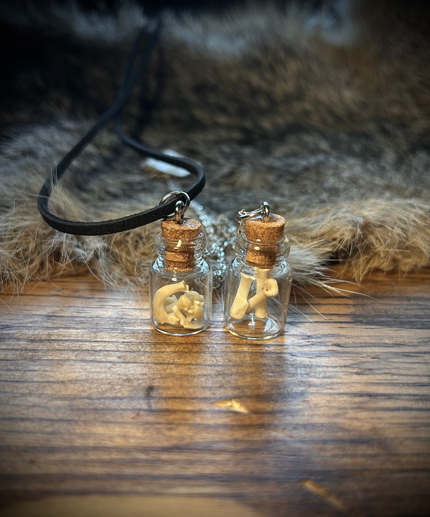Curio bottle with bones pendant